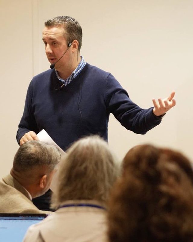 James Nicholson speaking to a room of UK business owners